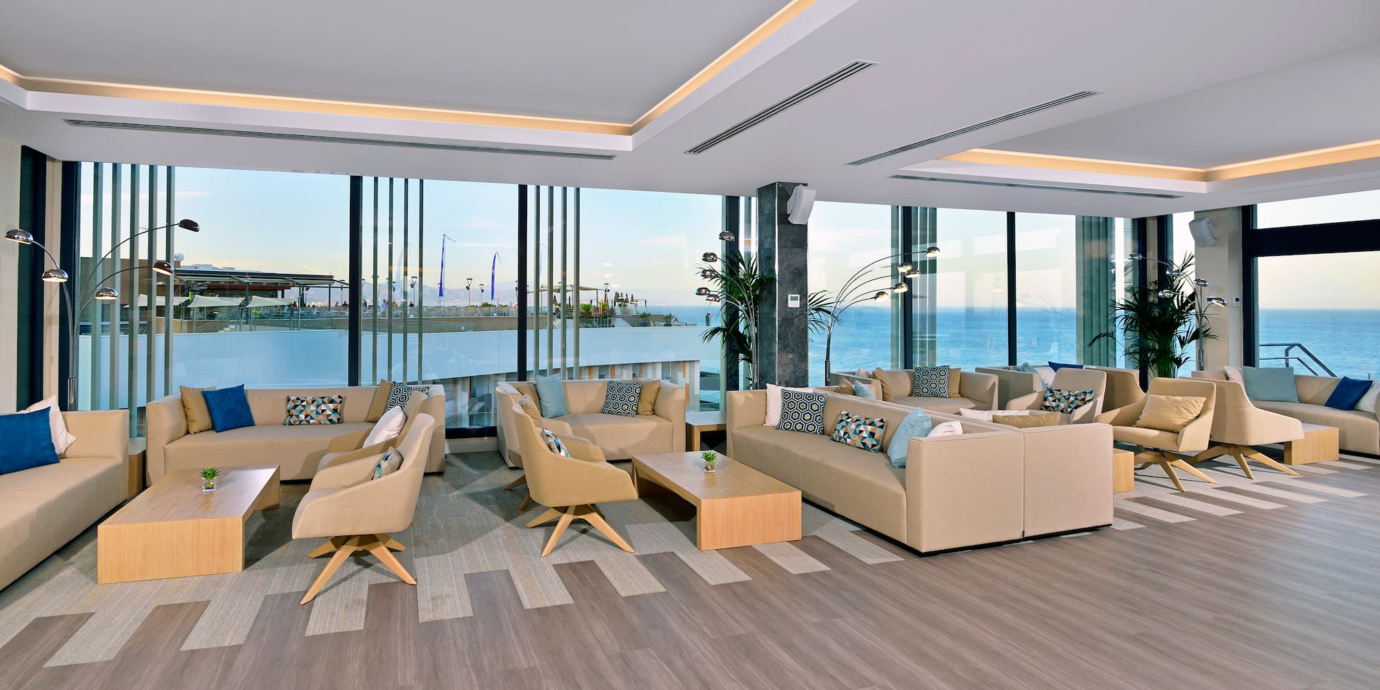 a room with couches and tables and chairs