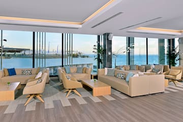 a room with couches and tables and chairs