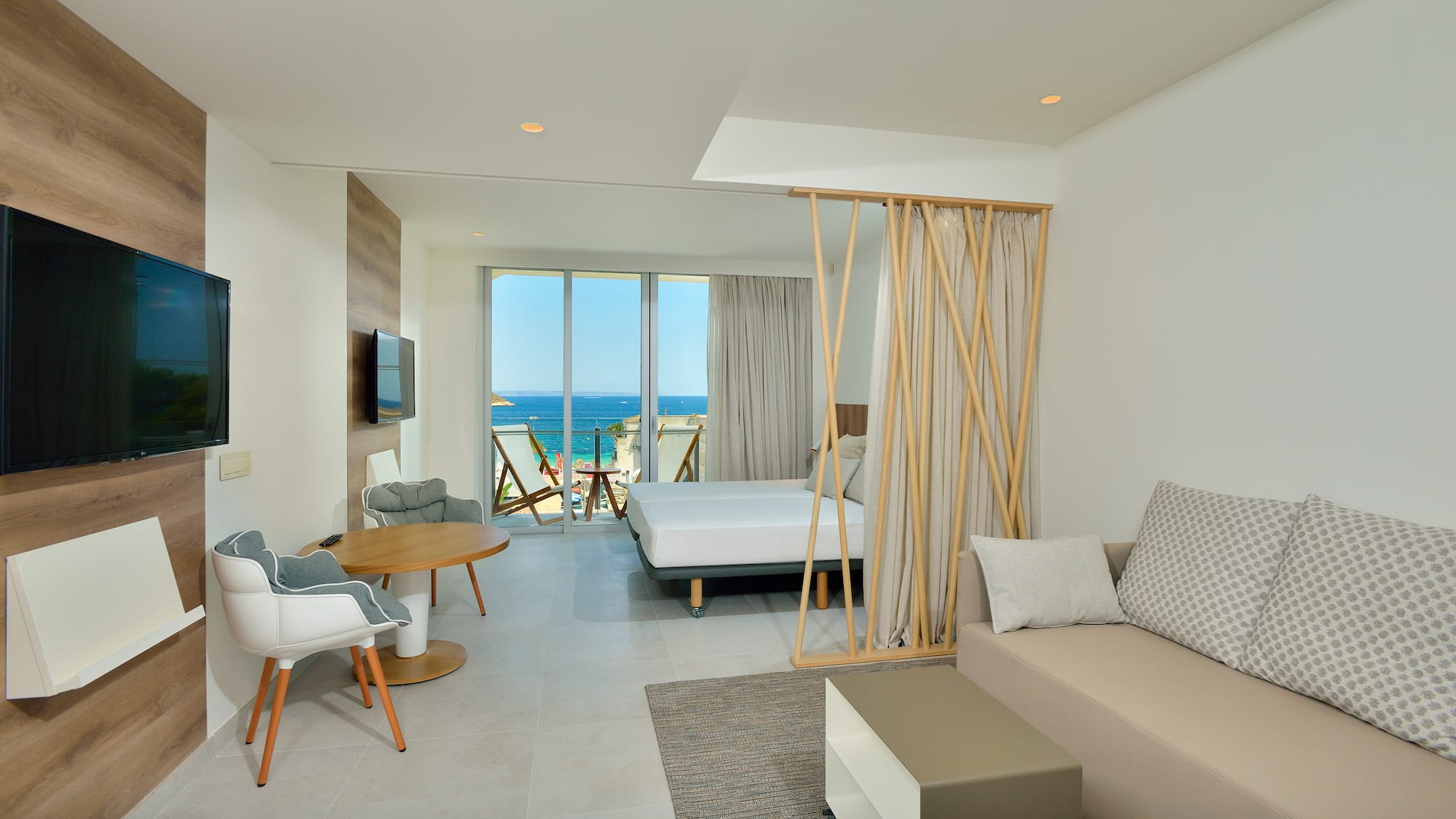 a room with a bed and a television