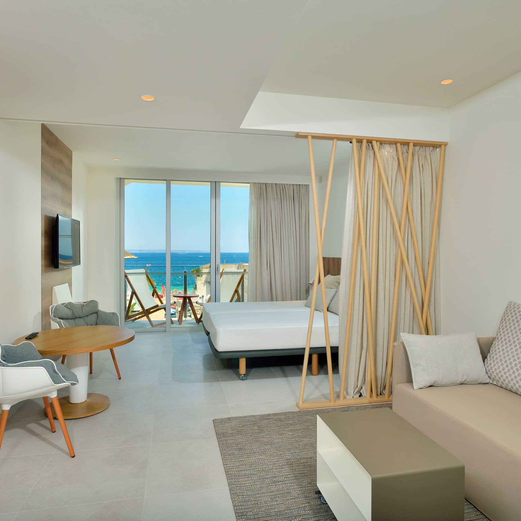 a room with a bed and a television