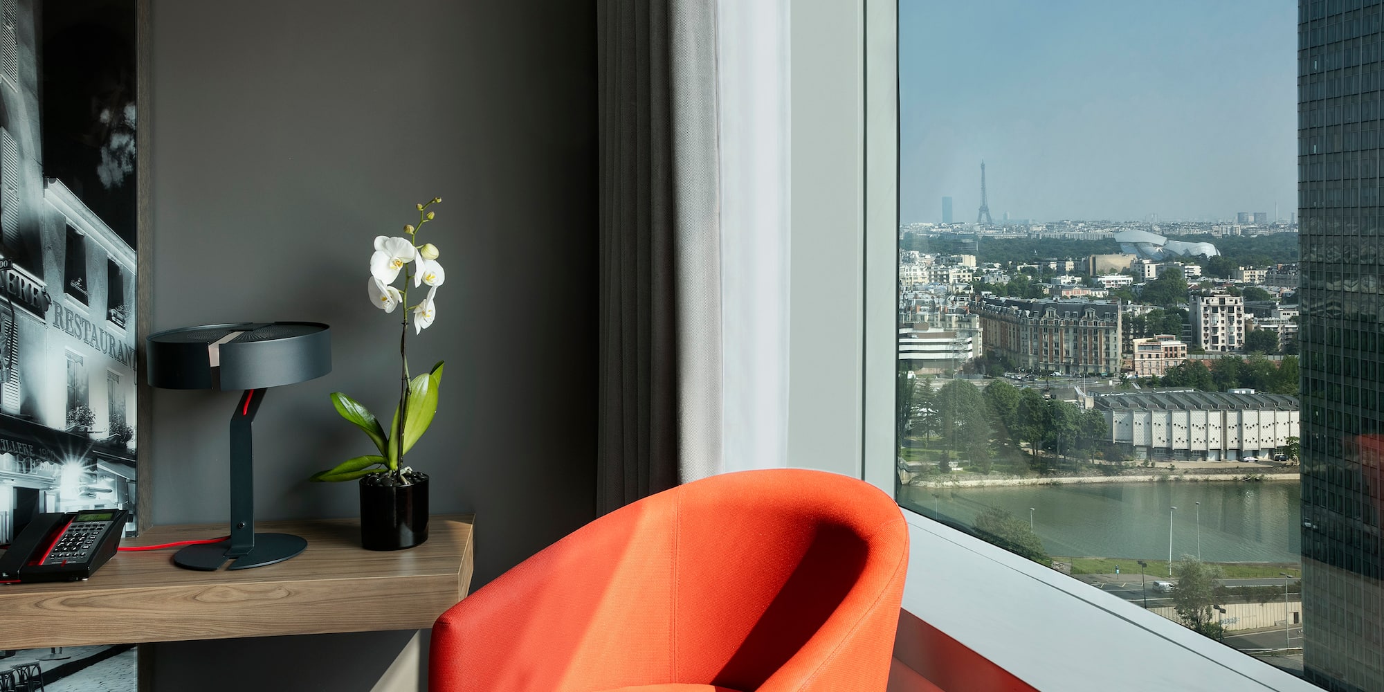 a room with a large window and a chair