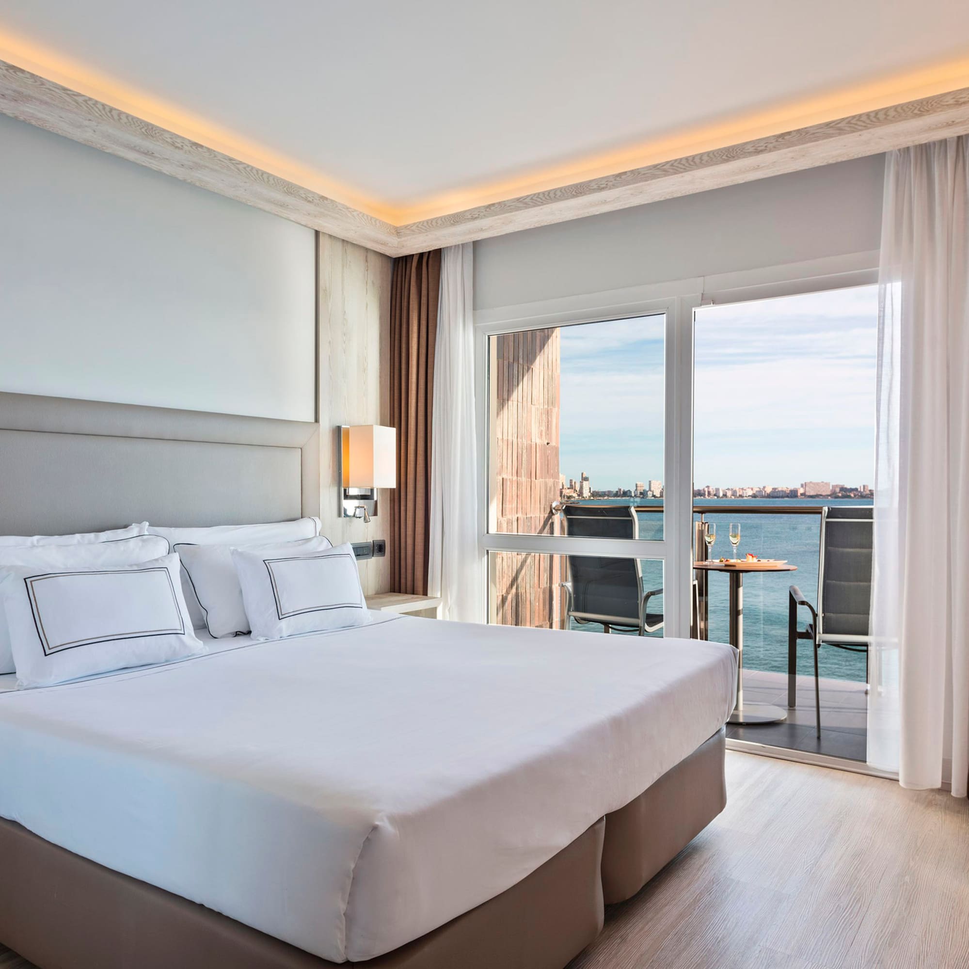 a bed with a view of the ocean