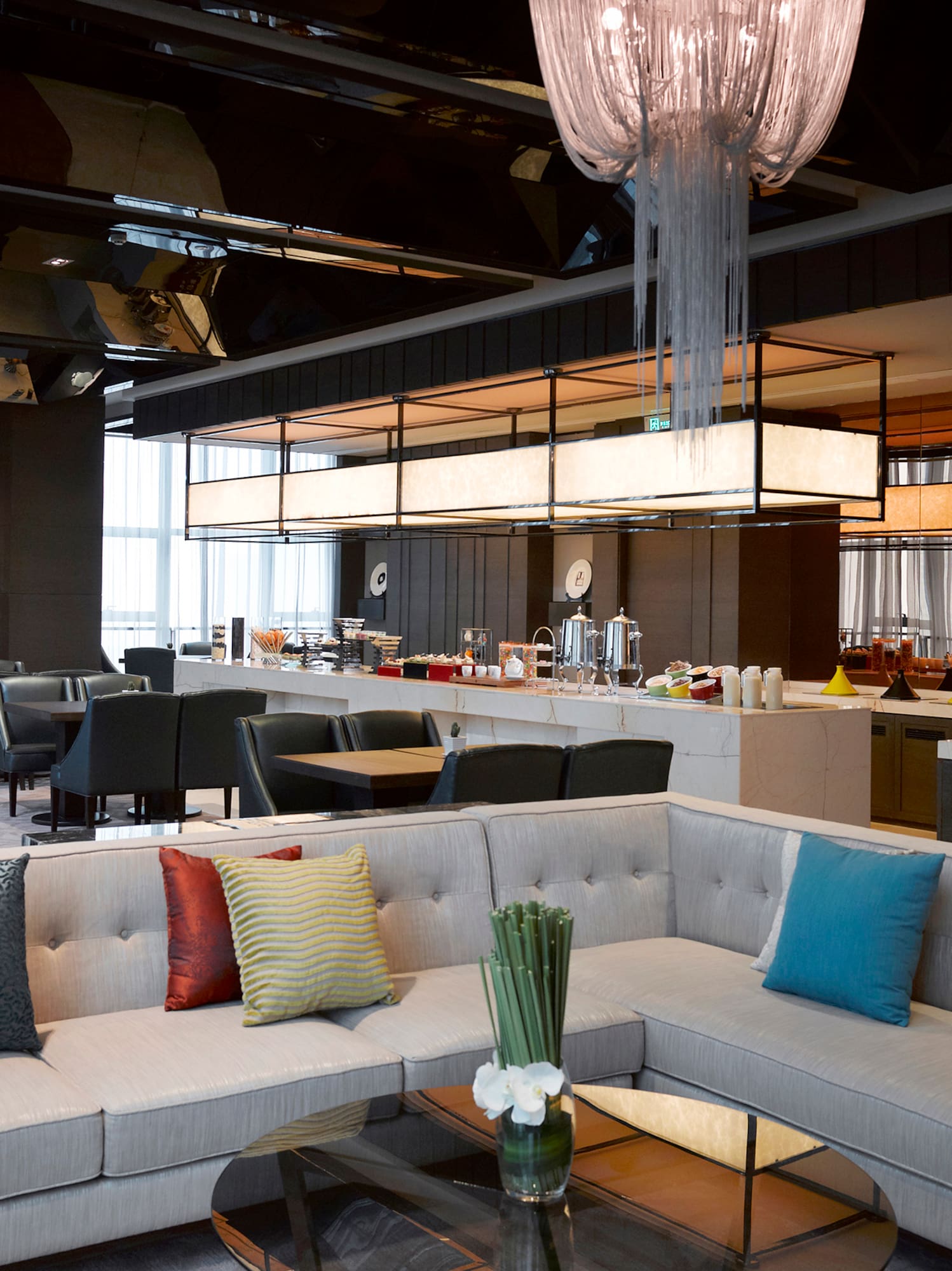 a room with couches and tables