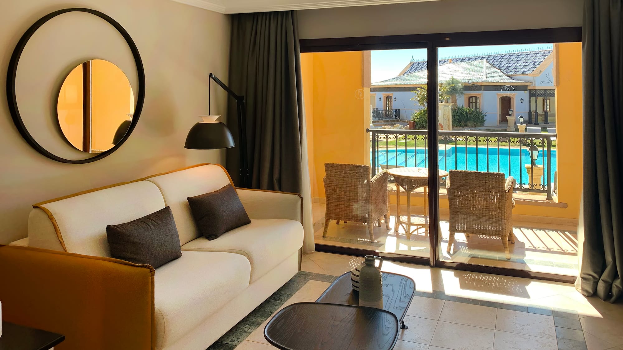 a living room with a glass door and a couch