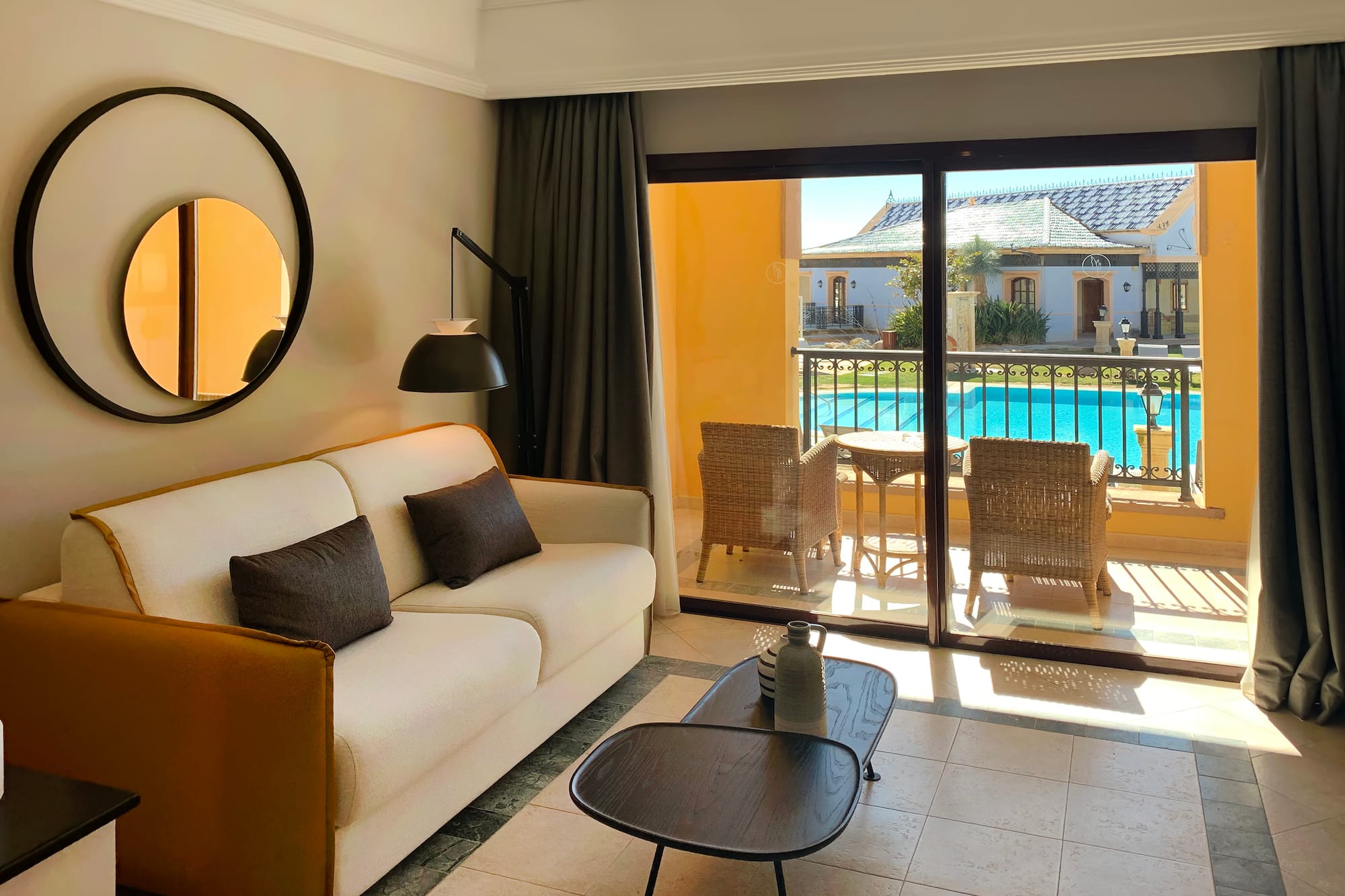 a living room with a glass door and a couch