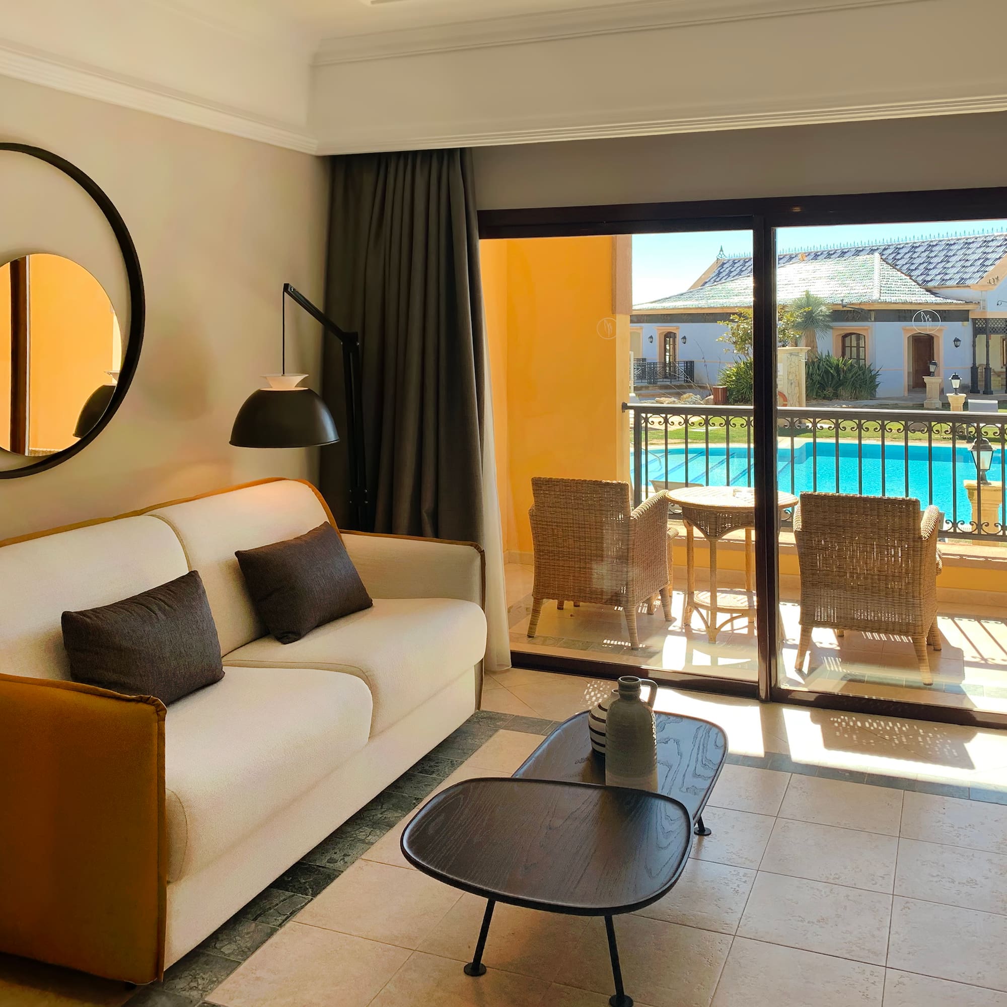 a living room with a glass door and a couch