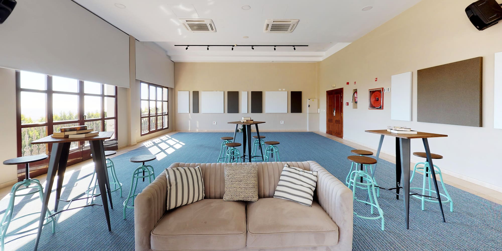 a room with a couch and tables