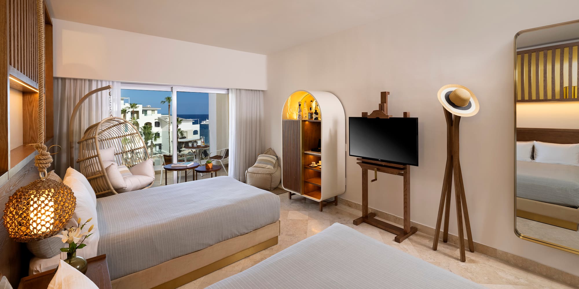 a room with two beds and a television