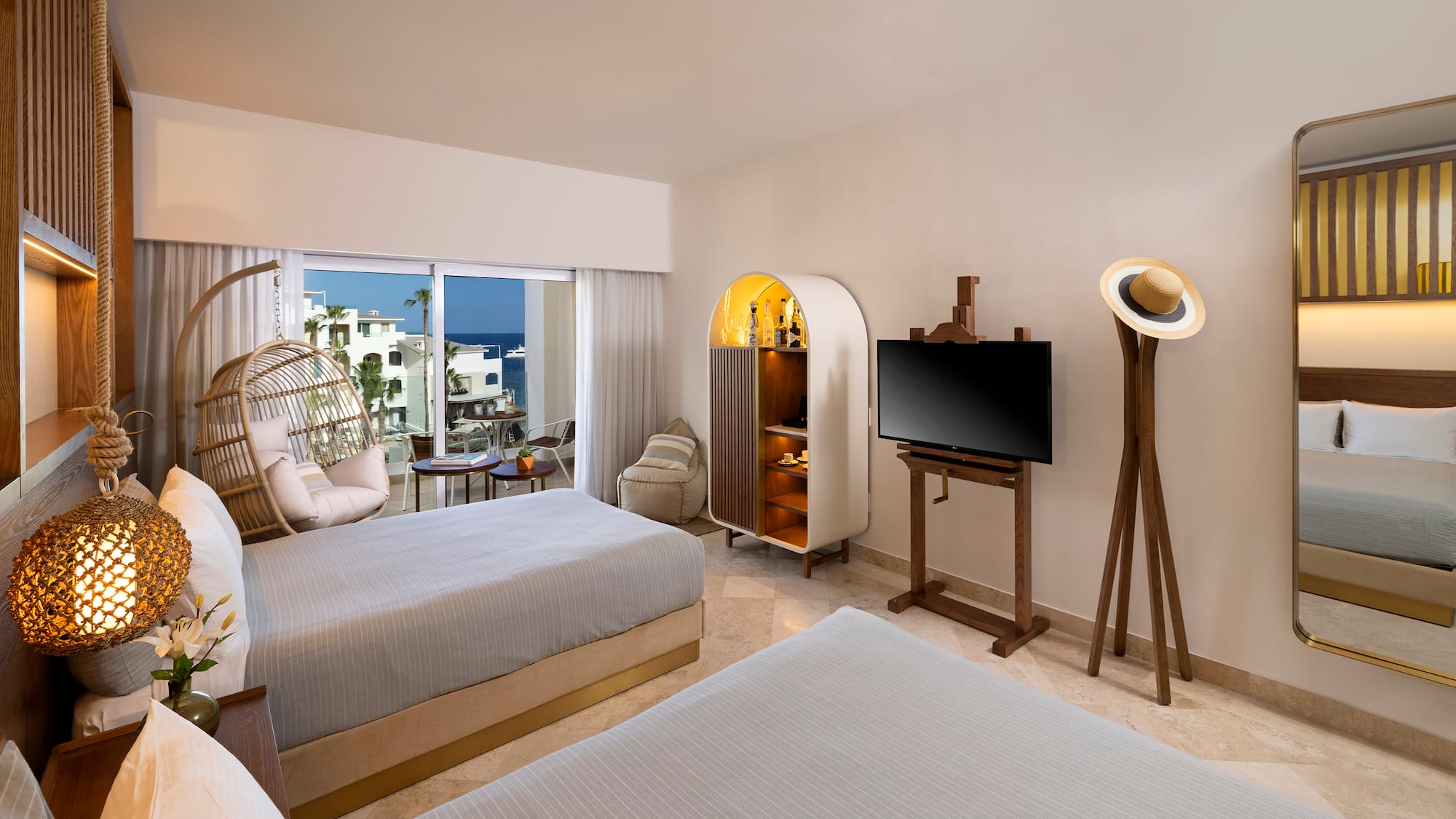 a room with two beds and a television