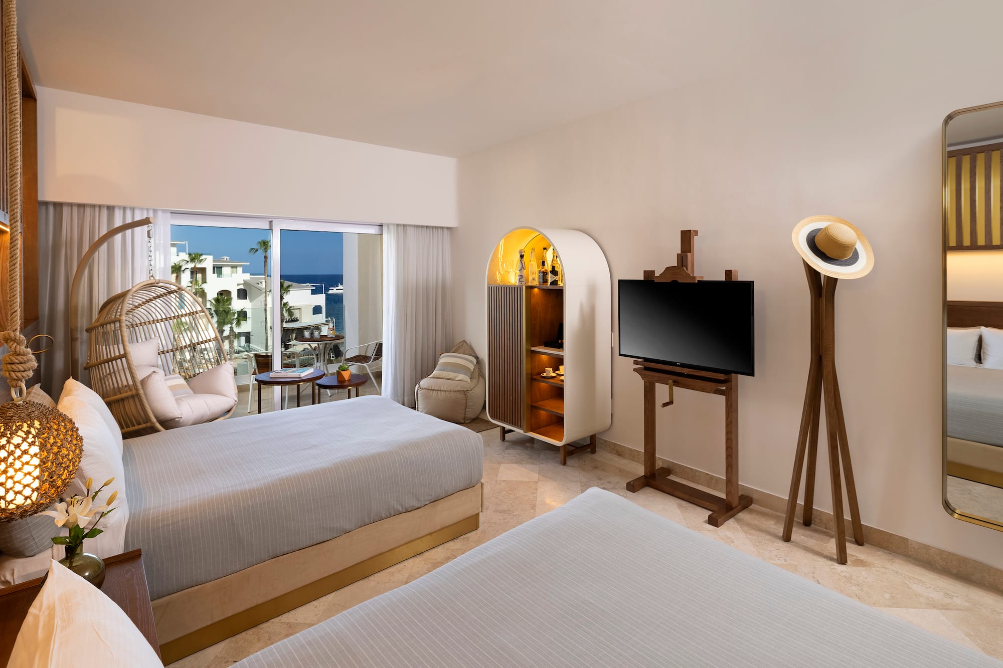 a room with two beds and a television