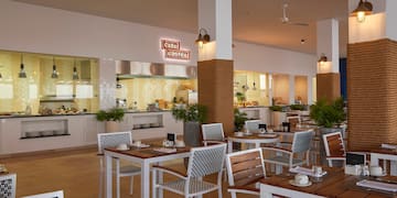 a restaurant with tables and chairs