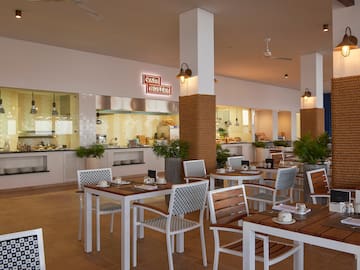 a restaurant with tables and chairs