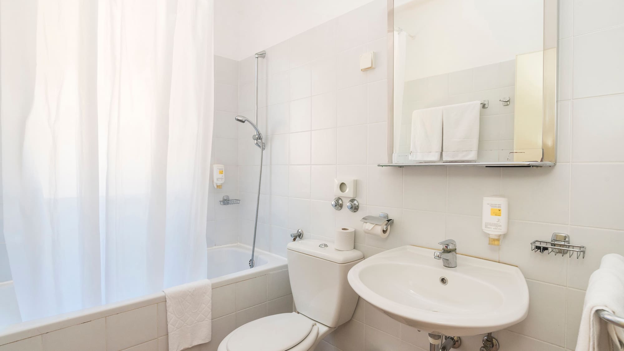 a bathroom with a sink and toilet