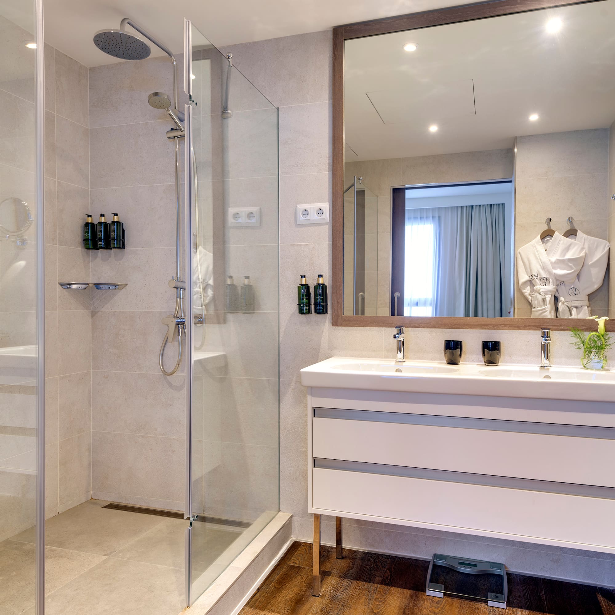 a bathroom with a shower and a sink