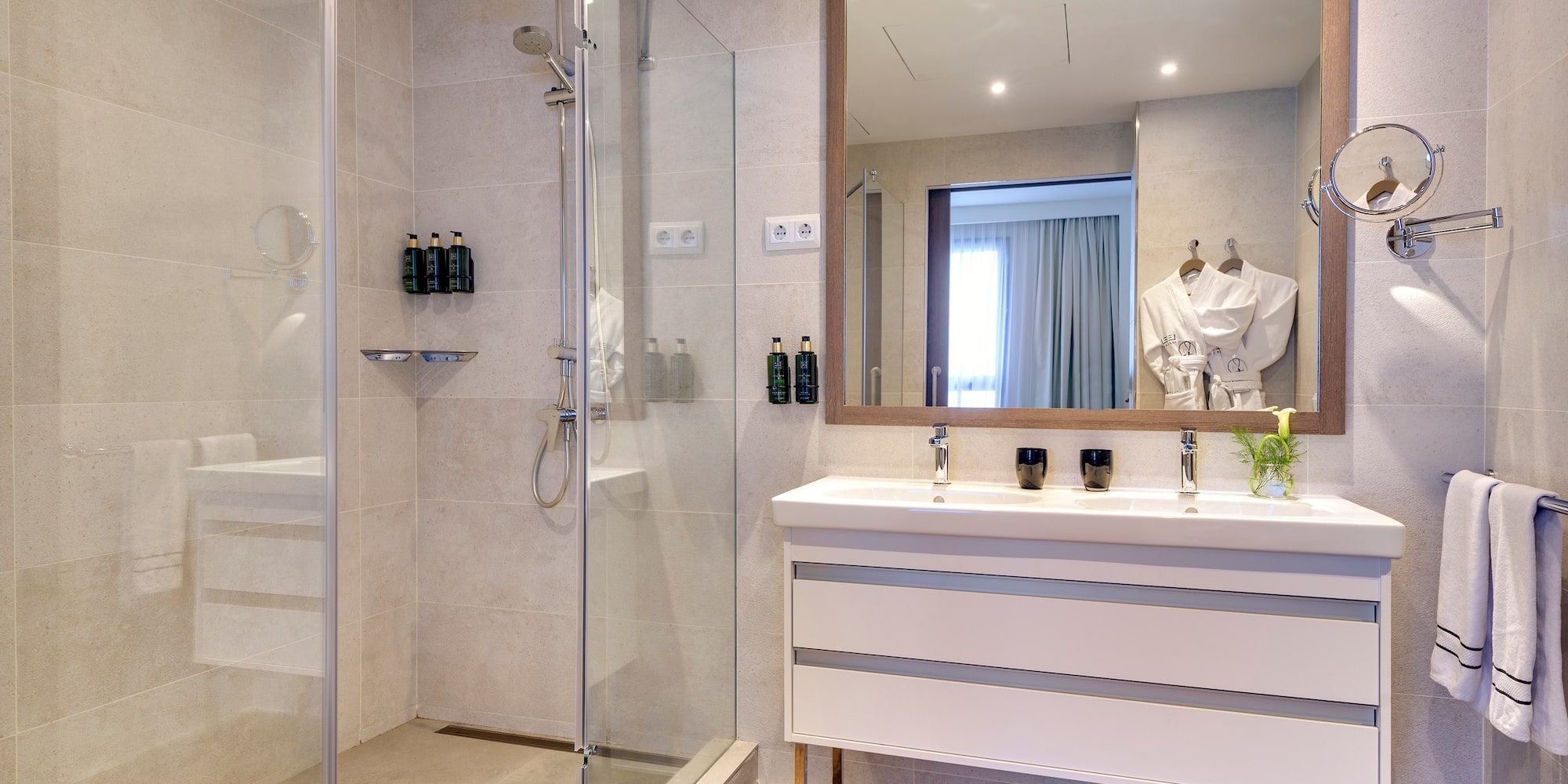 a bathroom with a shower and a sink
