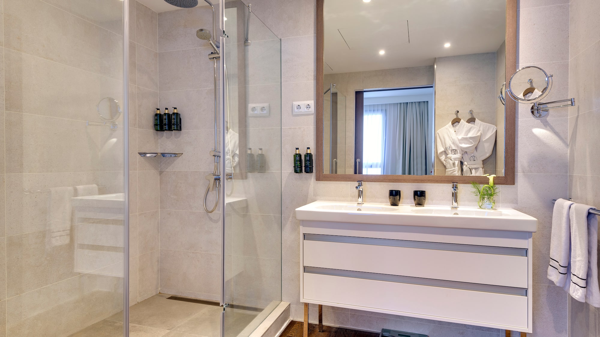 a bathroom with a shower and a sink