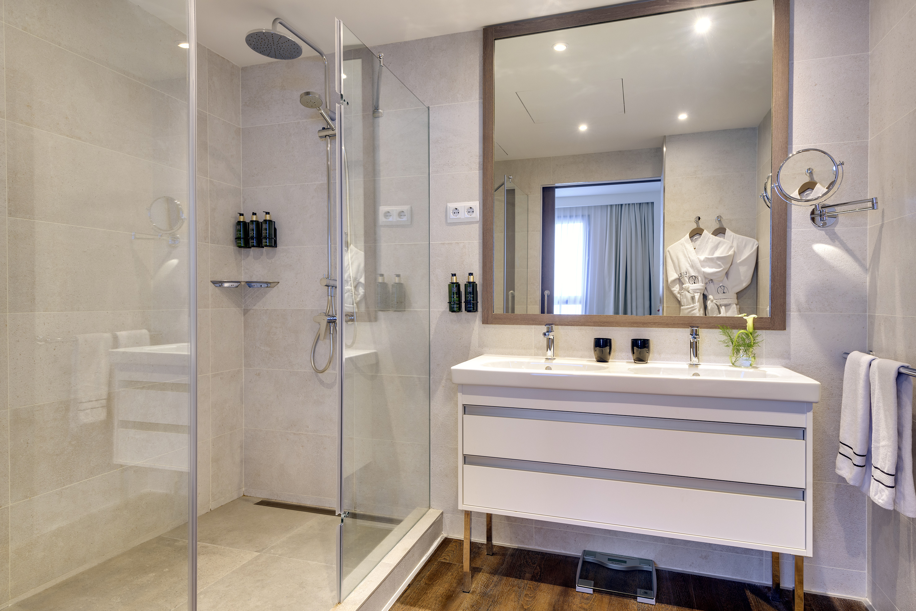 a bathroom with a shower and a sink