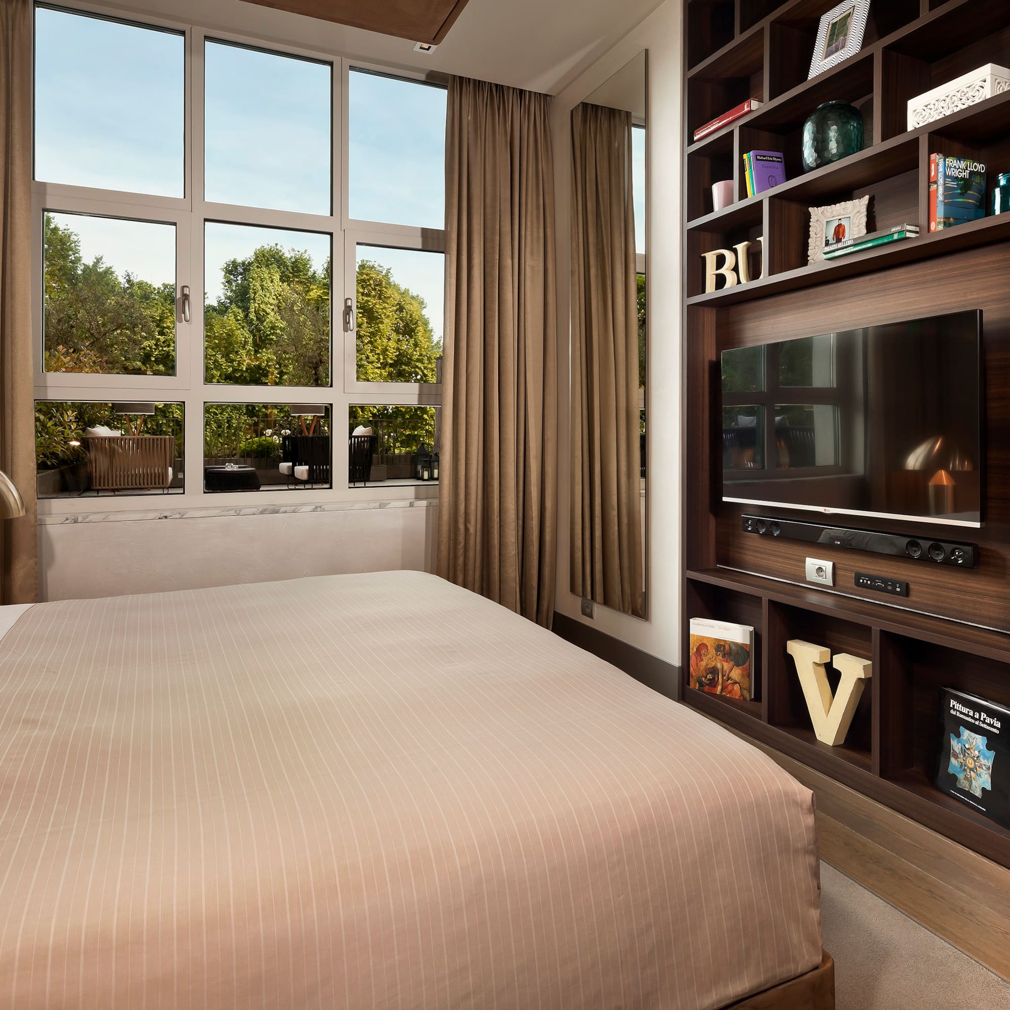 a room with a tv and a shelf