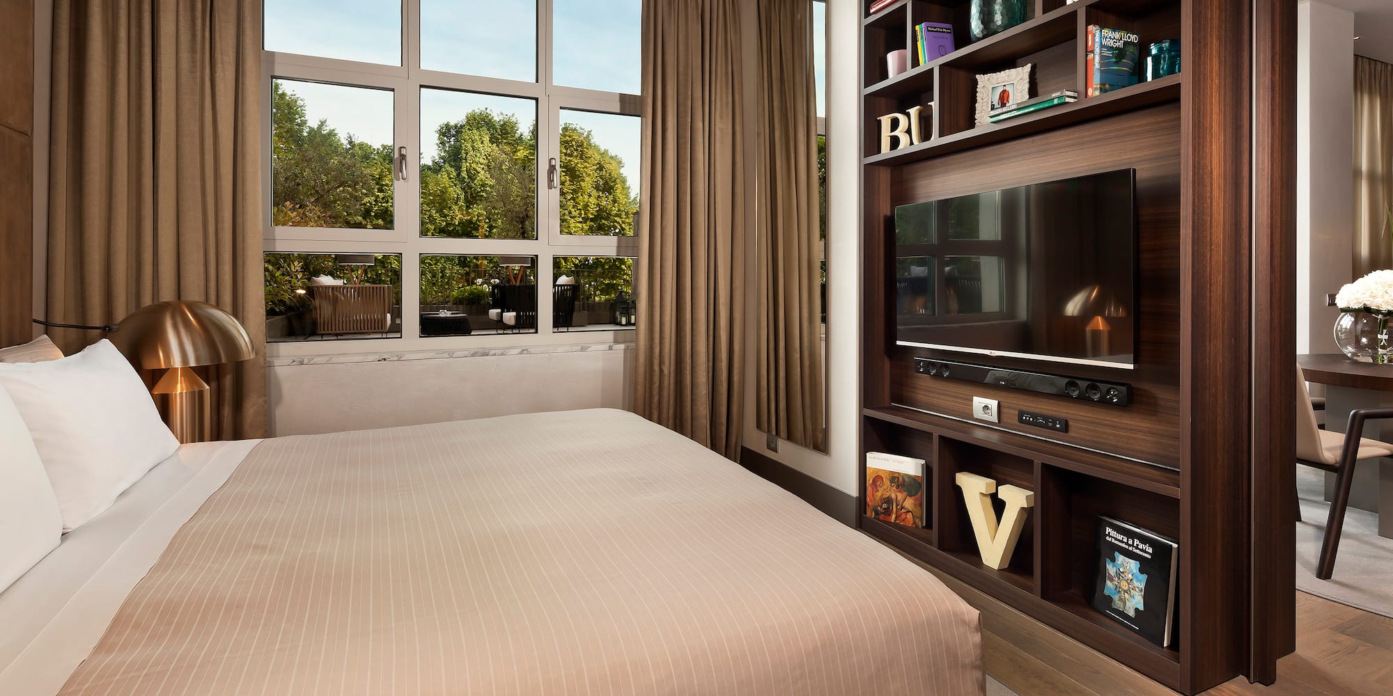 a room with a tv and a shelf