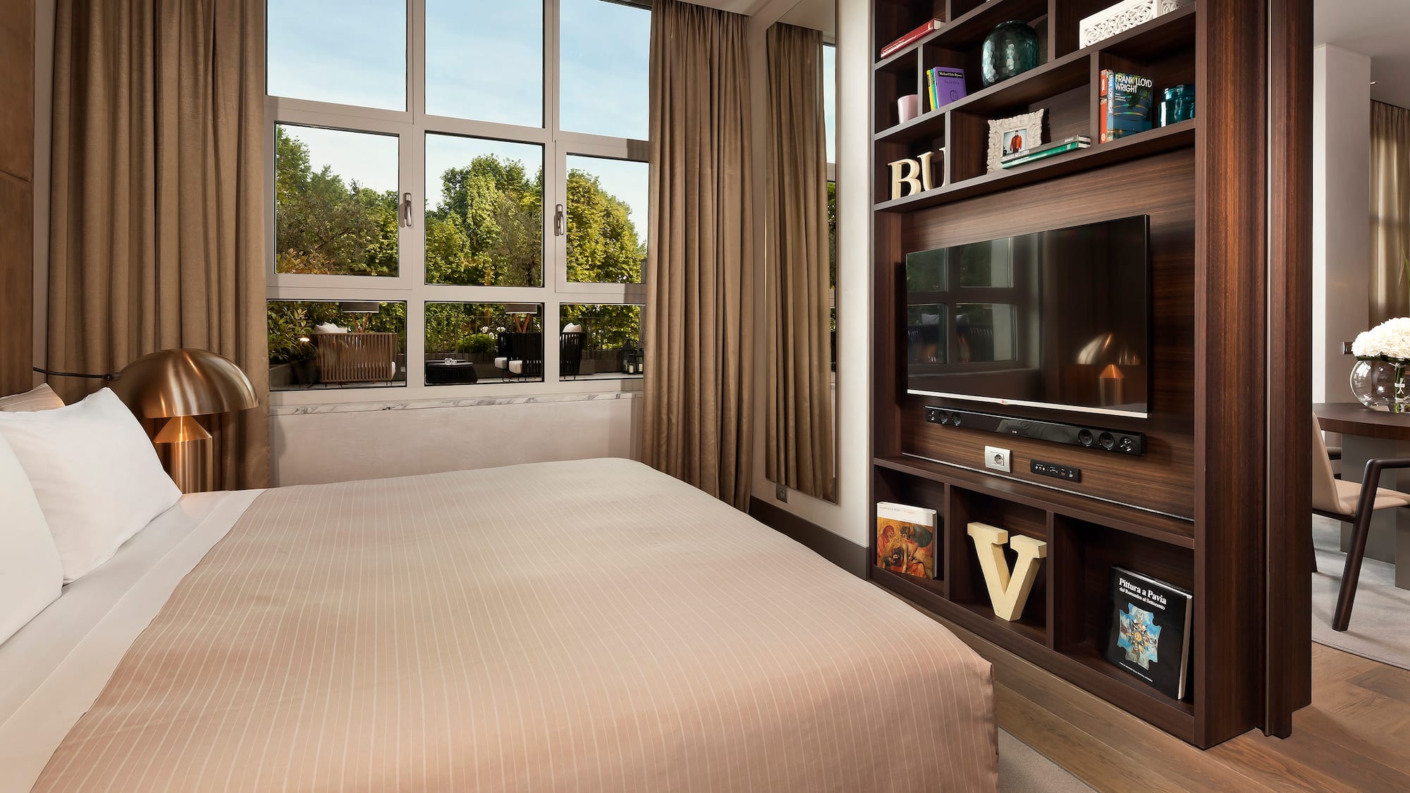 a room with a tv and a shelf