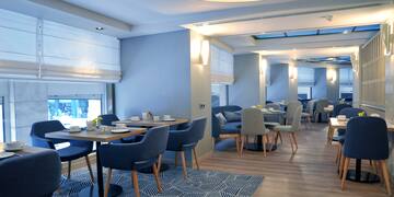 a room with tables and chairs