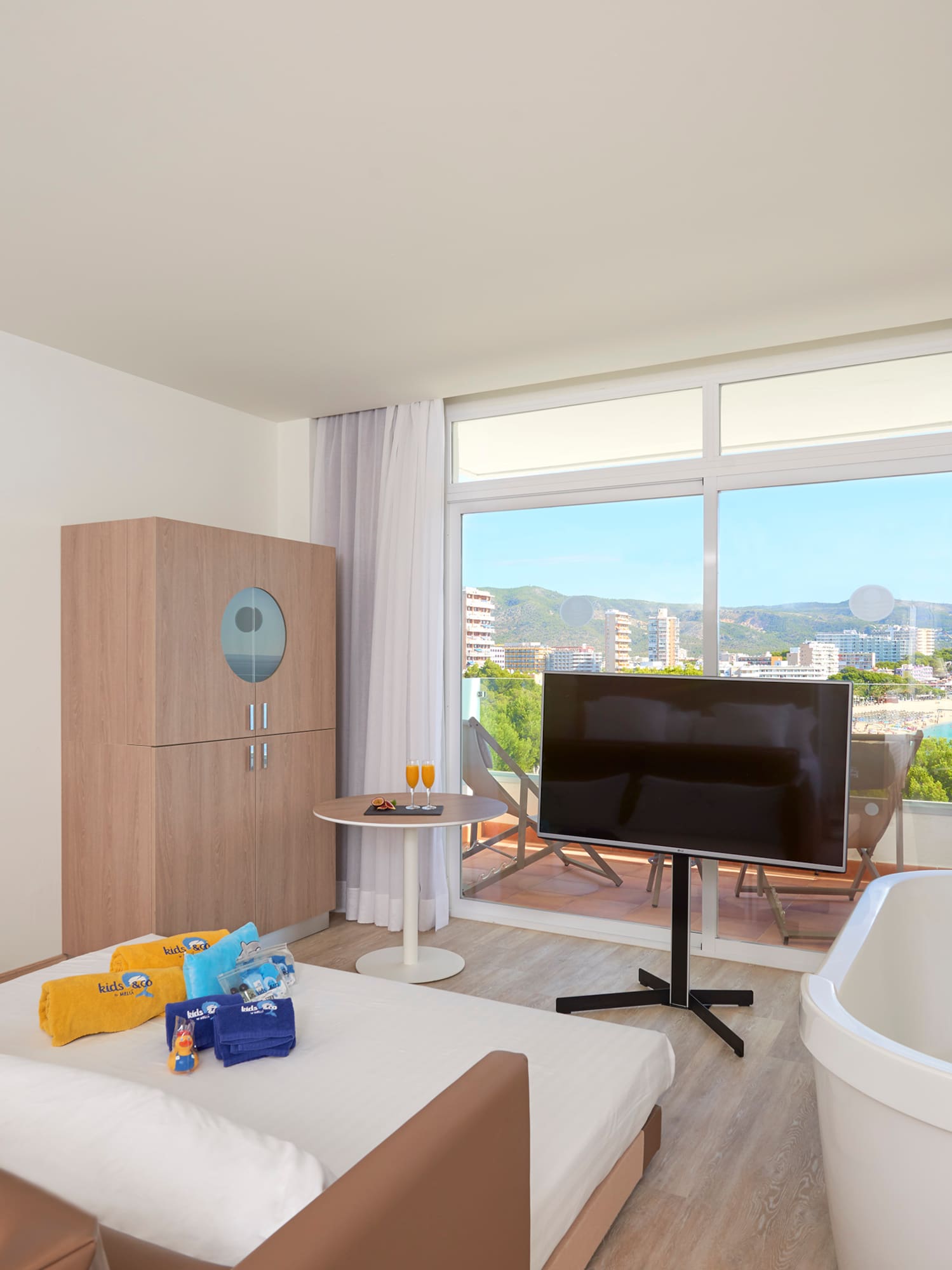 a room with a television and a tub