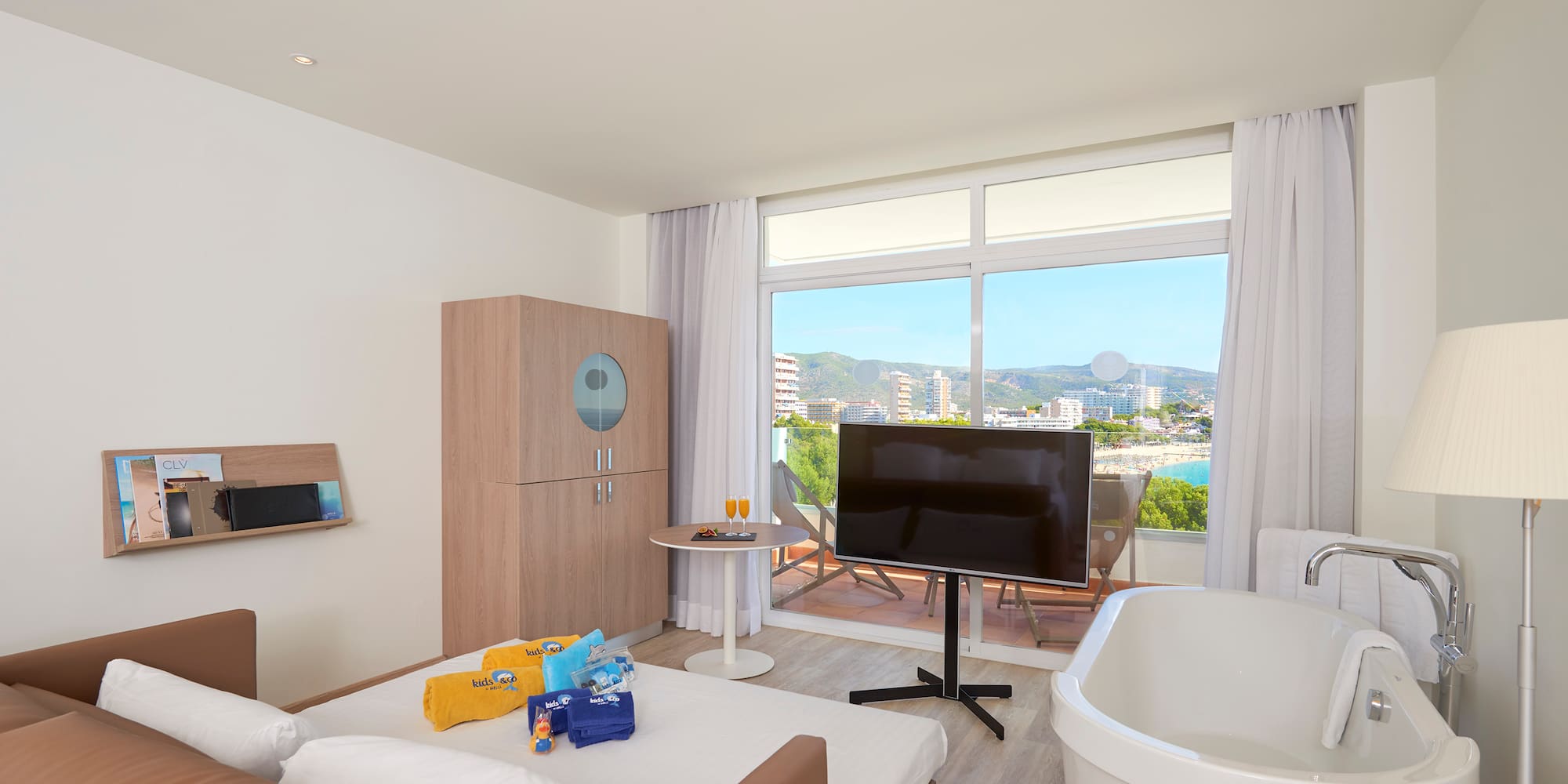 a room with a television and a tub