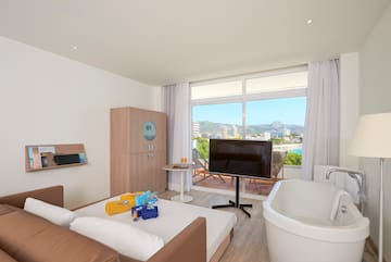 a room with a television and a tub