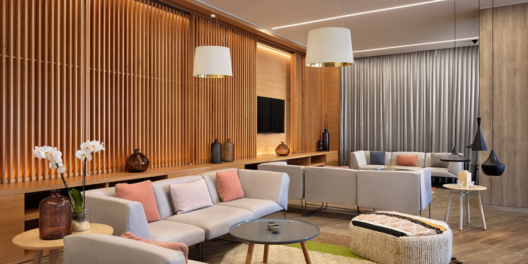 a room with couches and tables