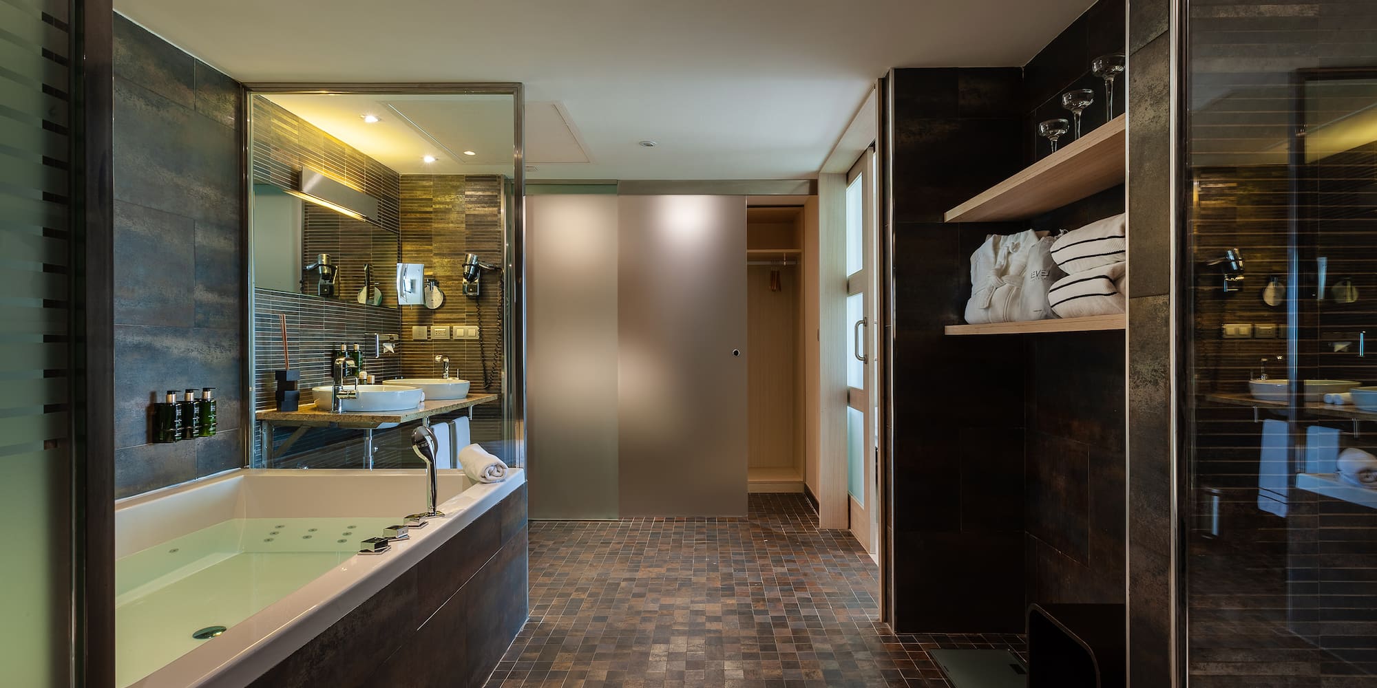 a bathroom with a bathtub and a shower