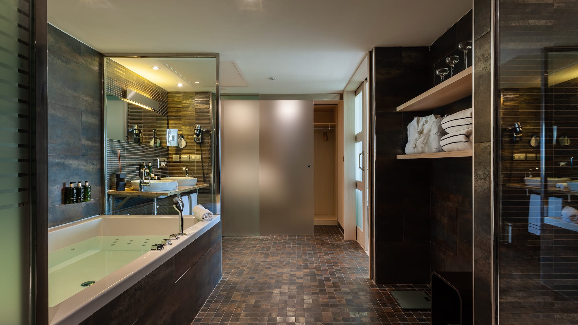 a bathroom with a bathtub and a shower