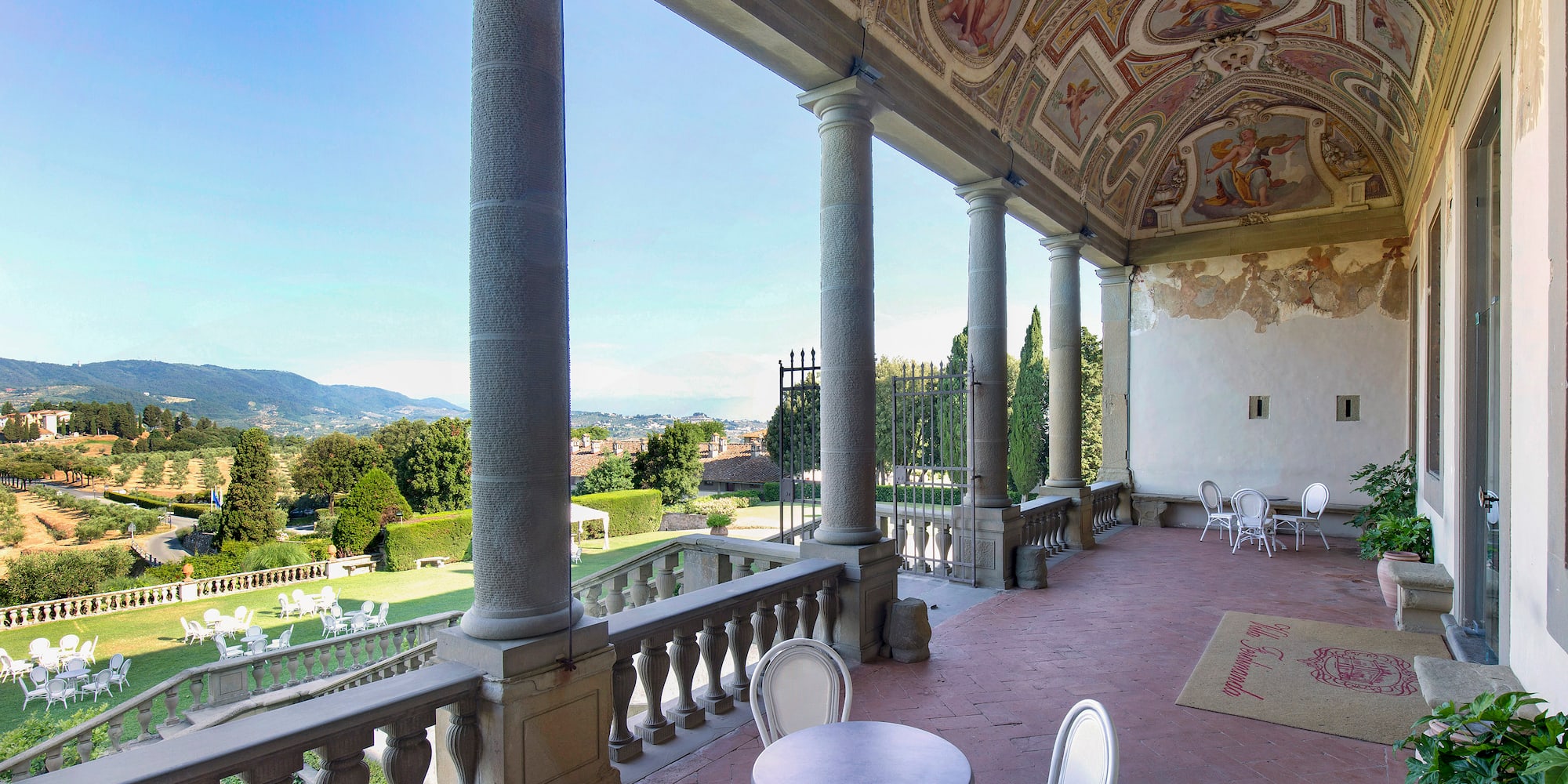 a patio with a stone ceiling and a painted ceiling