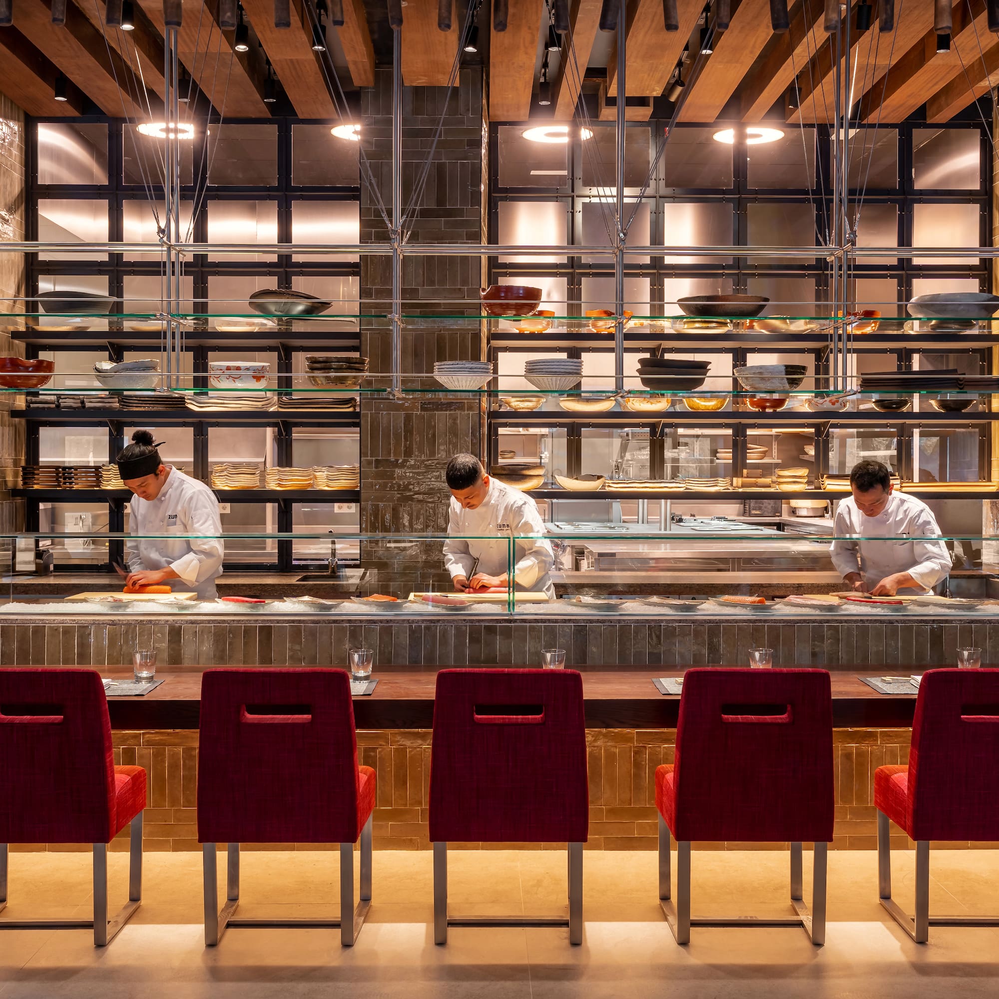 a group of people cooking in a restaurant