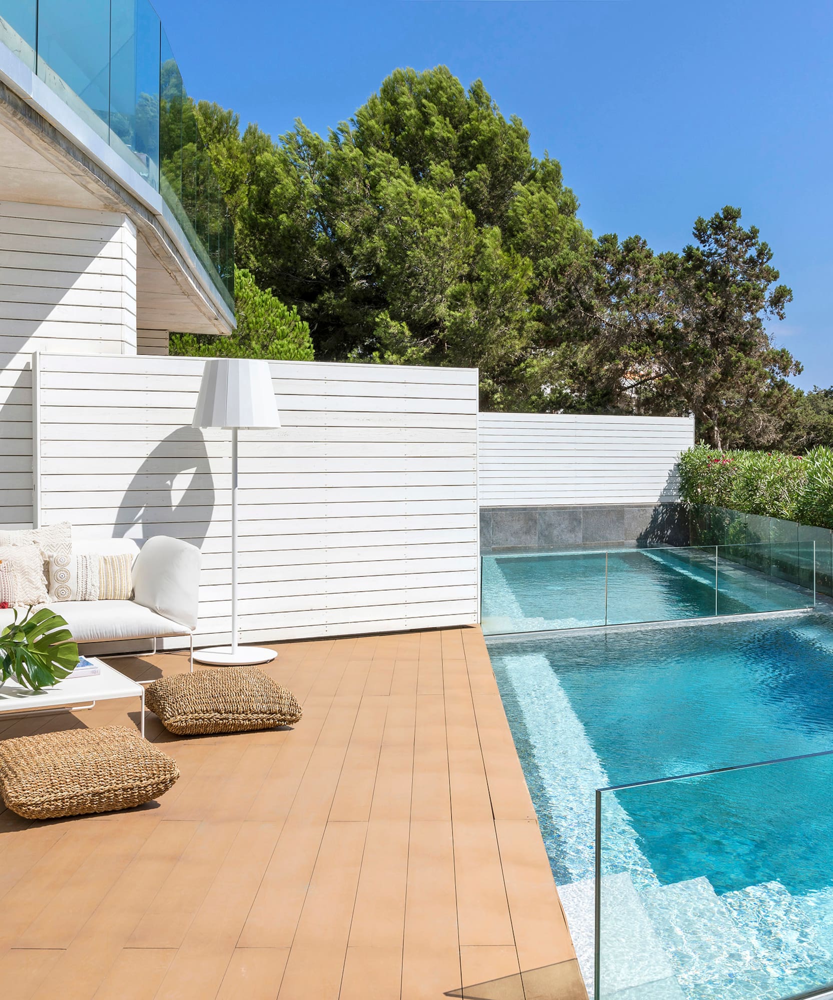 a swimming pool and a white building