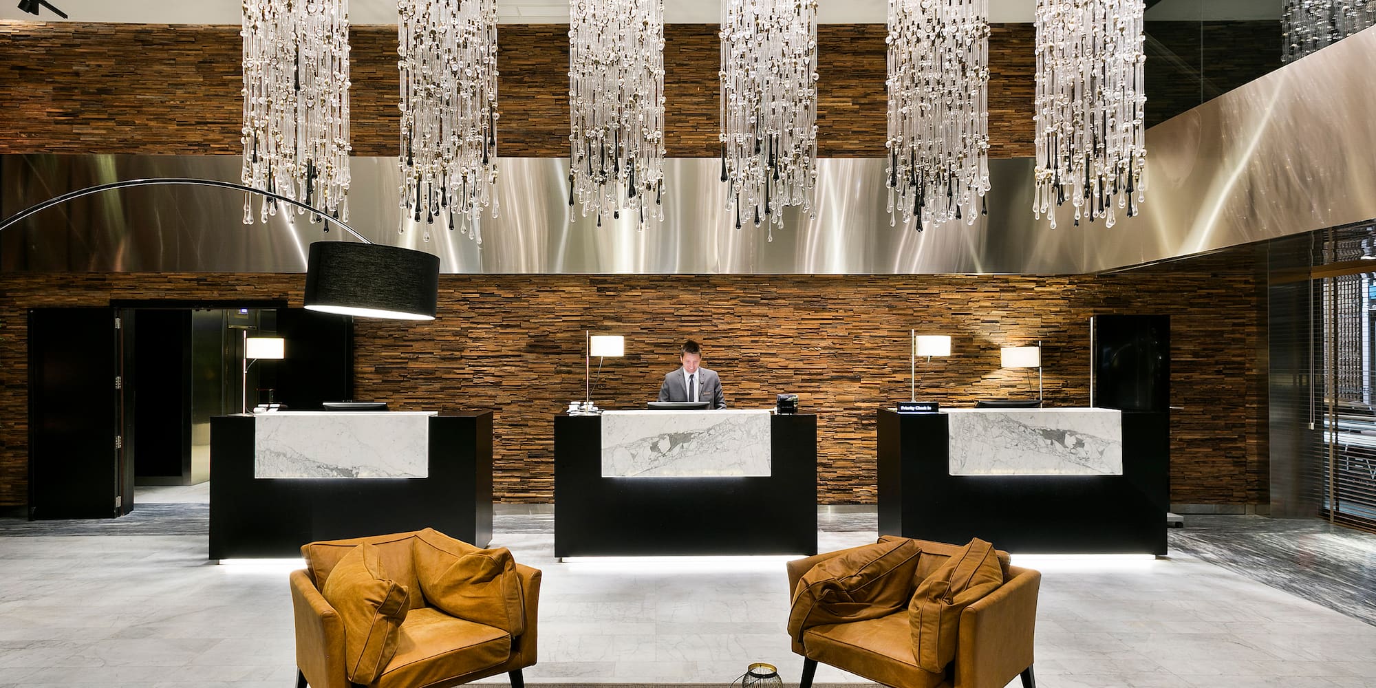 a man standing at a reception desk