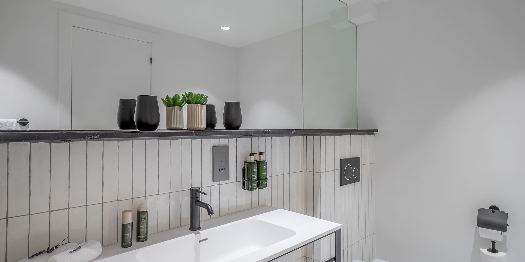 a bathroom with a sink and toilet