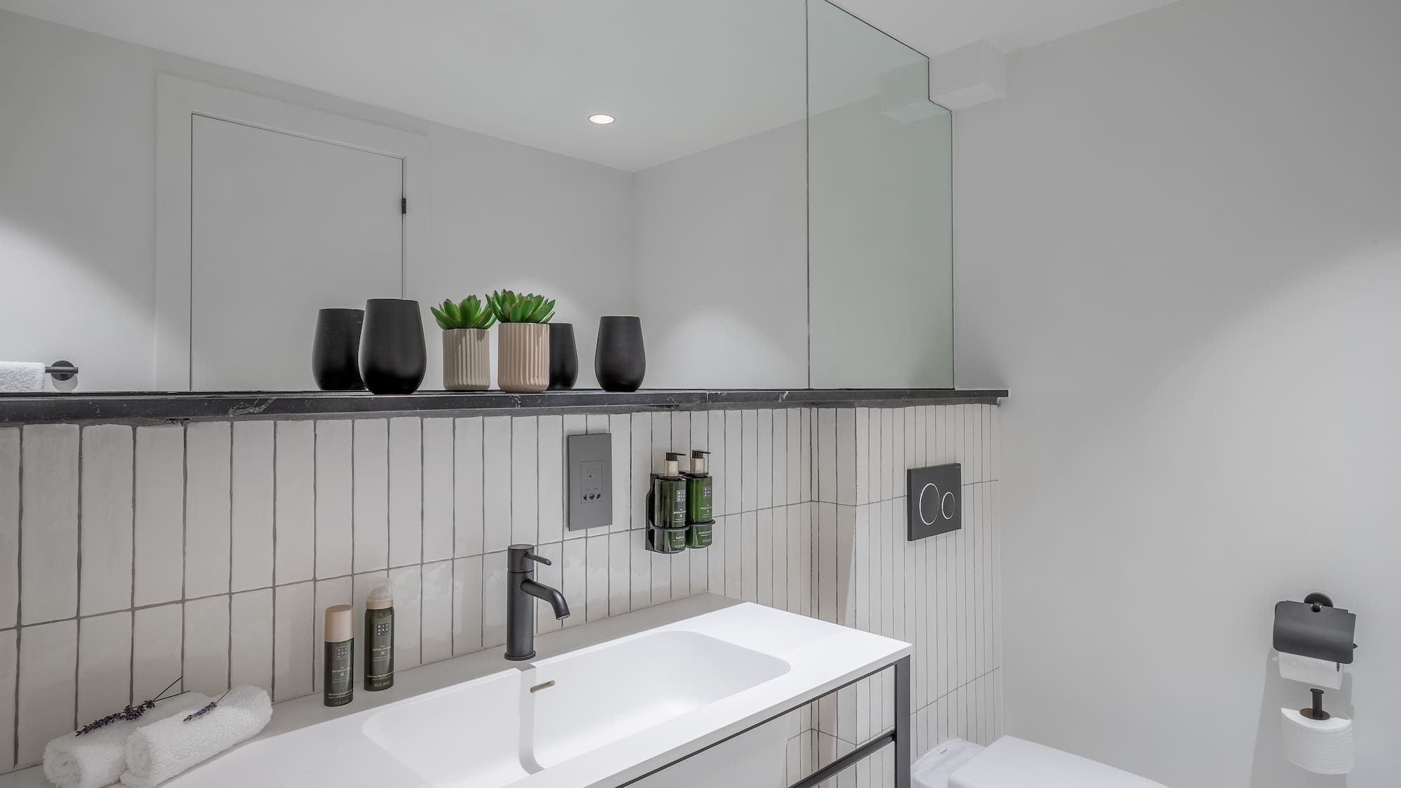 a bathroom with a sink and toilet