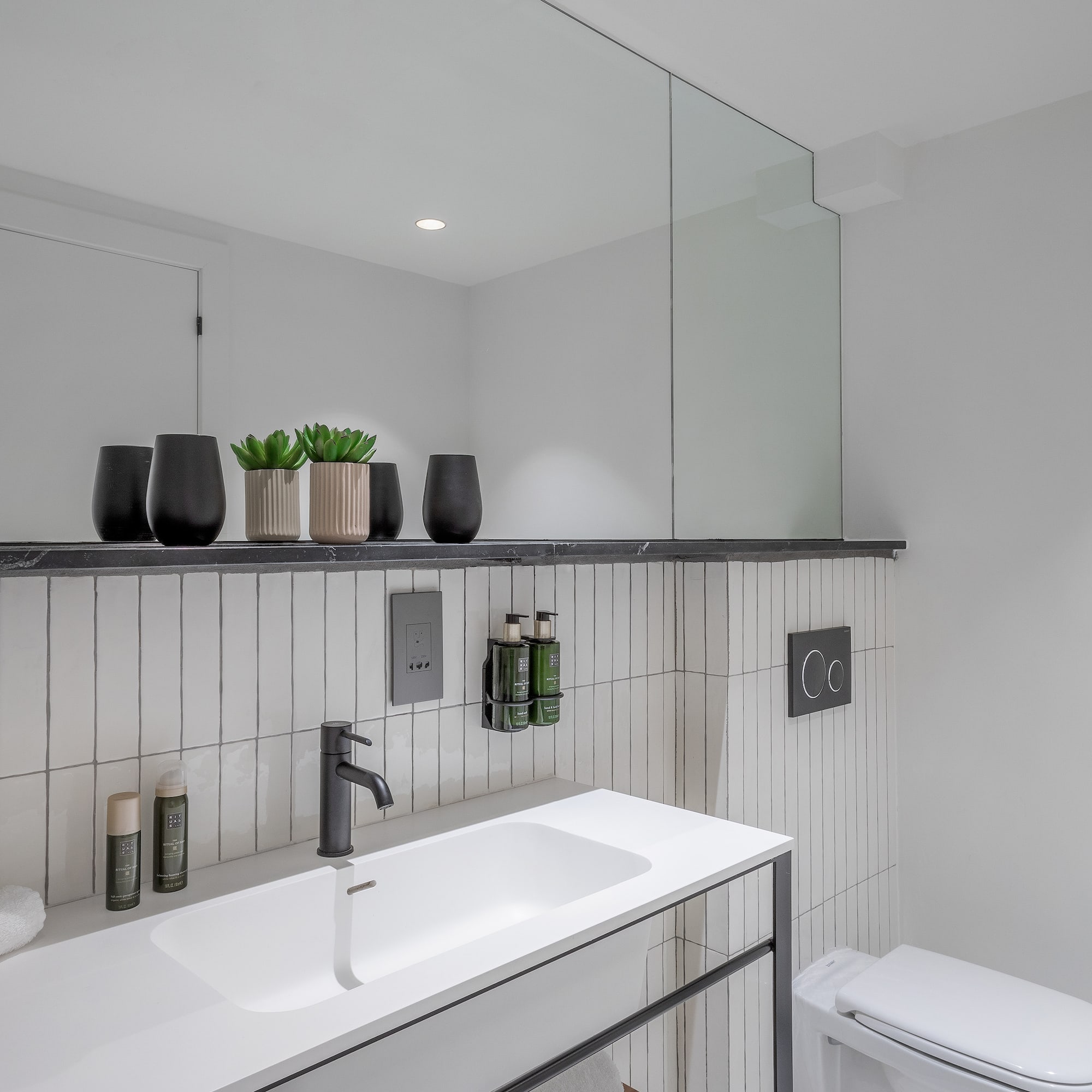 a bathroom with a sink and toilet