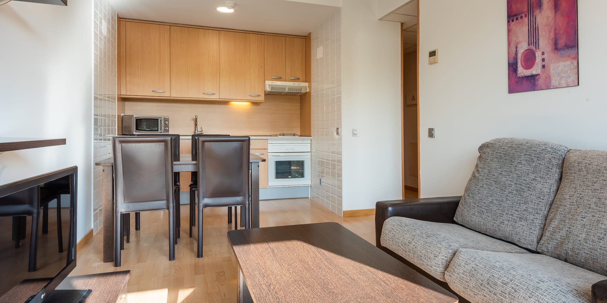a living room with a couch and table