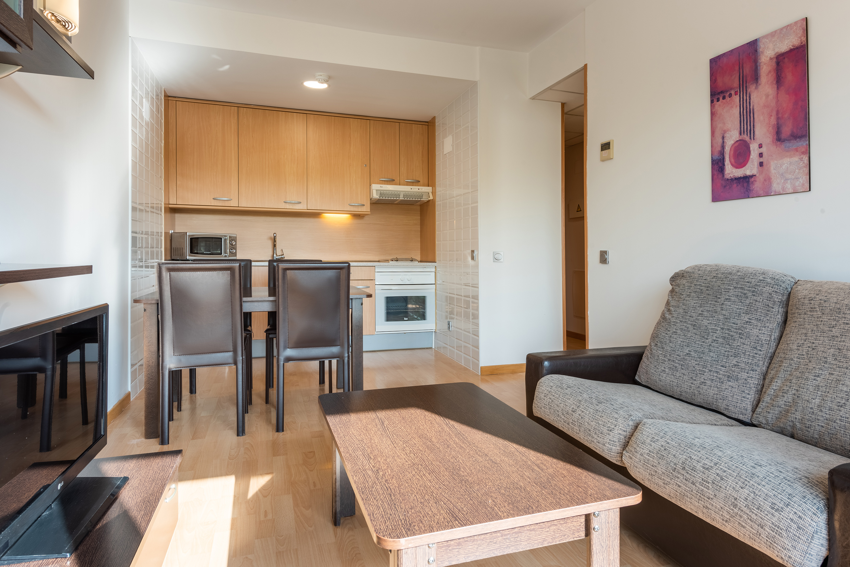 a living room with a couch and table