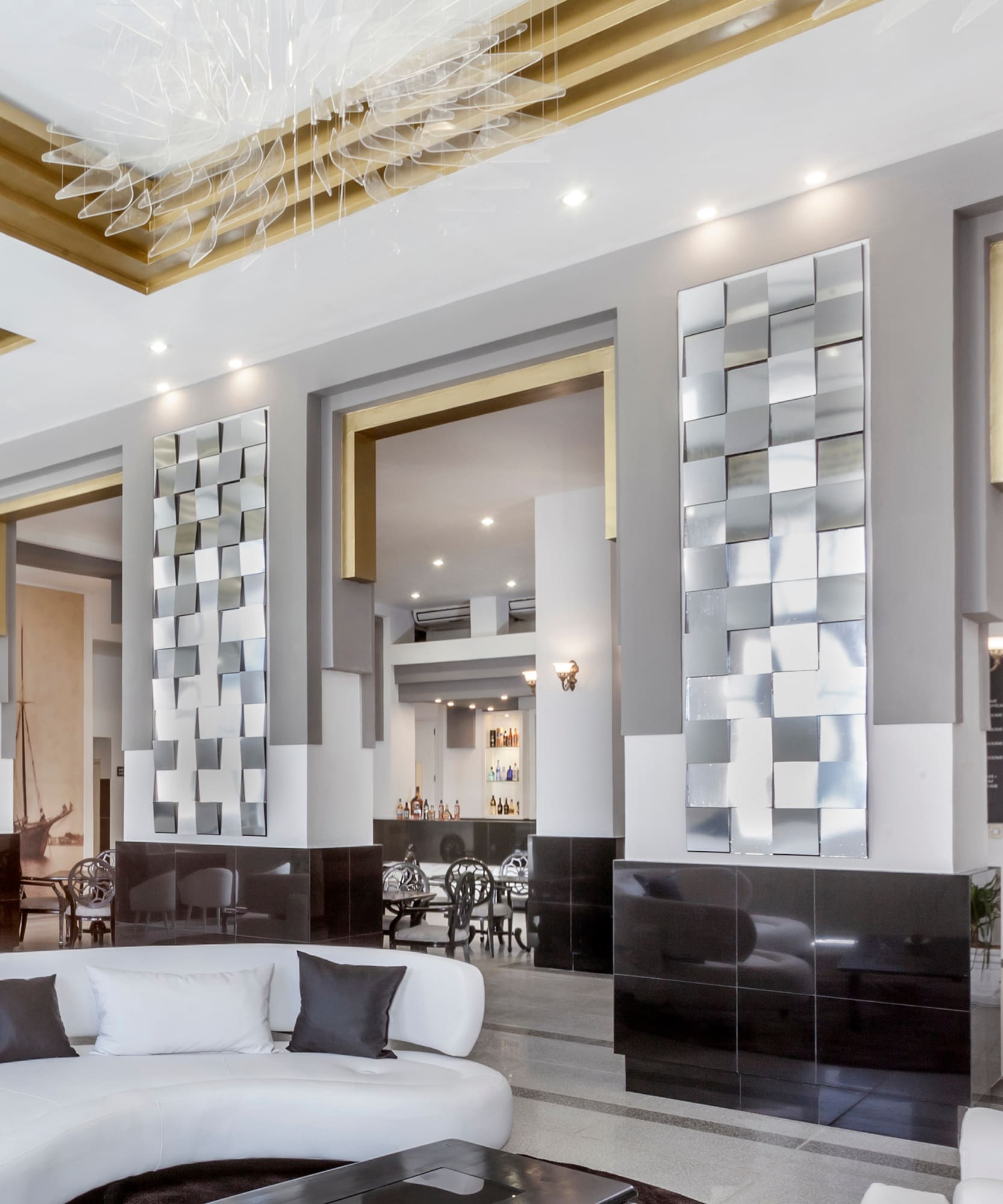 a room with a white couch and black and white walls