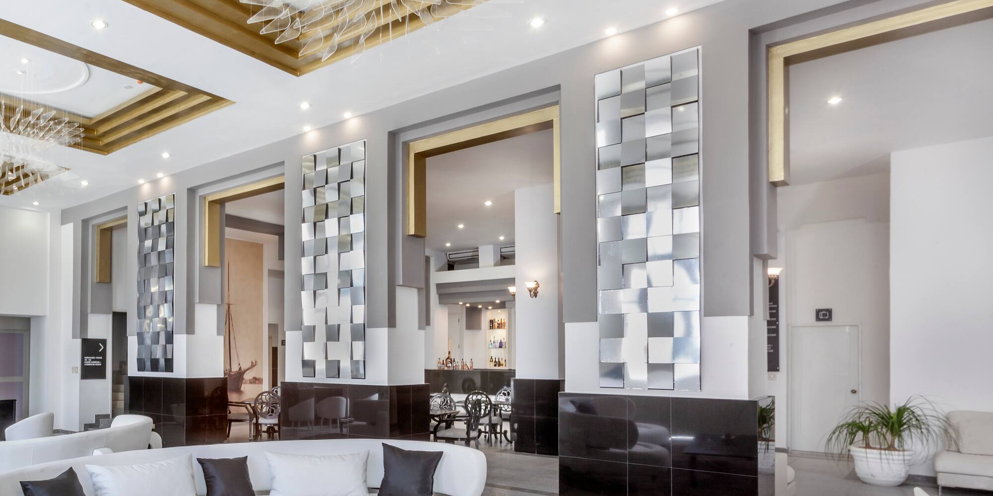 a room with a white couch and black and white walls