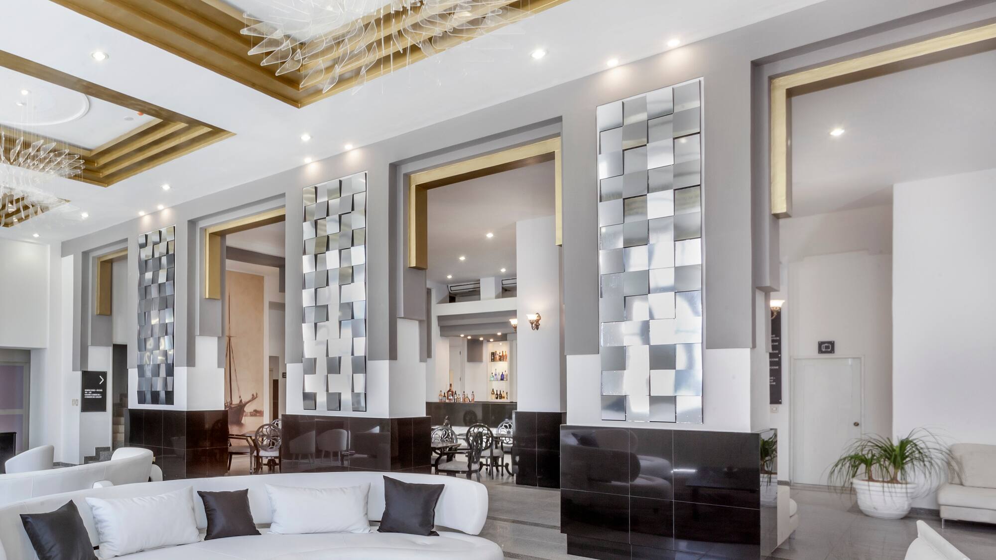 a room with a white couch and black and white walls