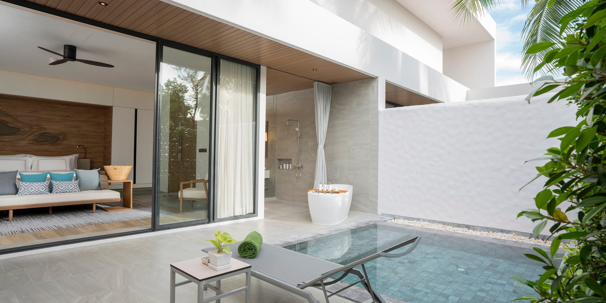 a pool and lounge chair in a house