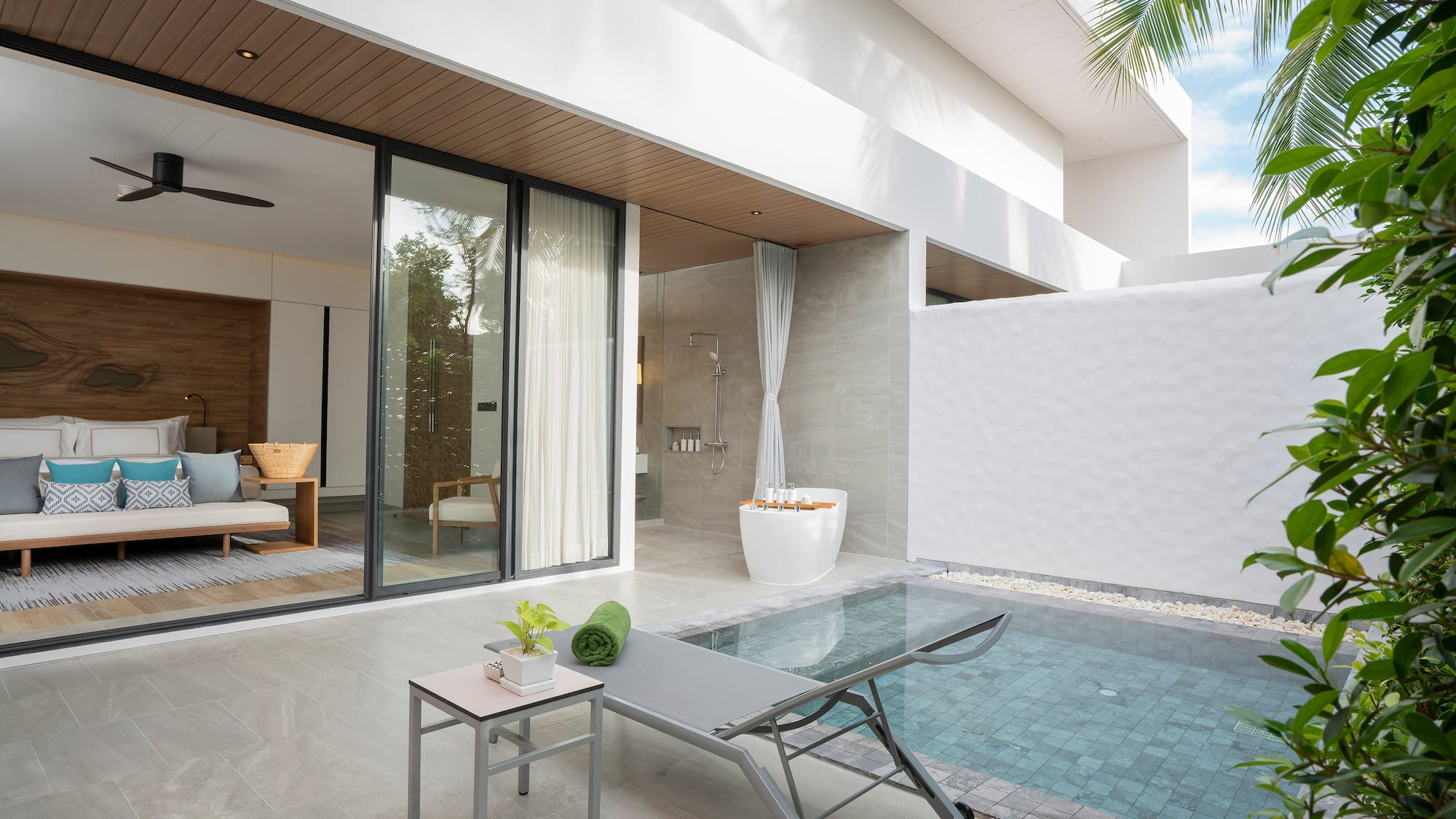 a pool and lounge chair in a house