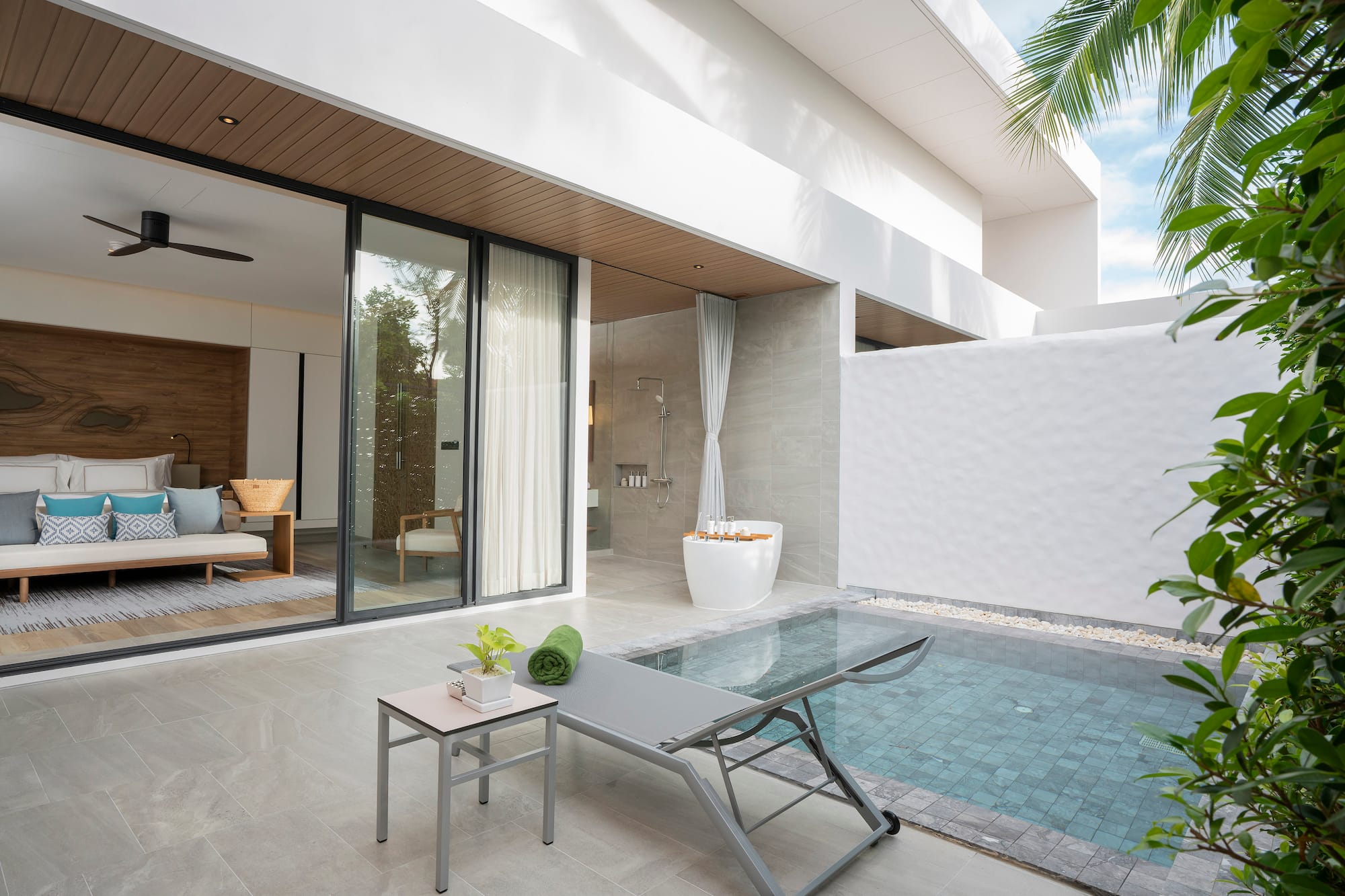 a pool and lounge chair in a house