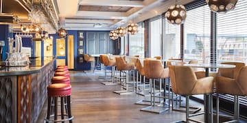 a room with chairs and tables