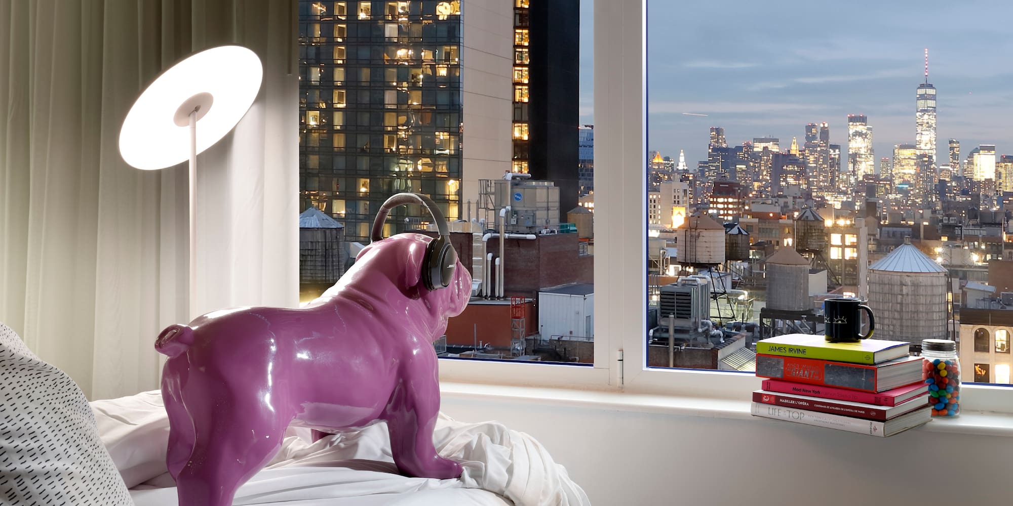 a purple dog statue on a bed
