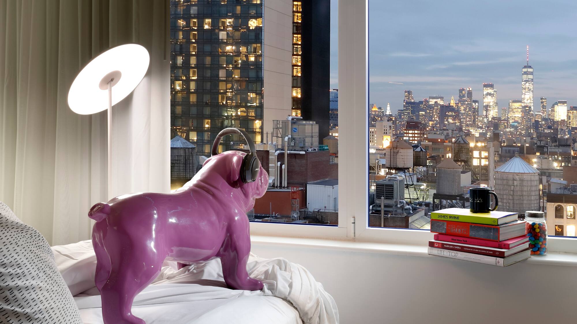 a purple dog statue on a bed