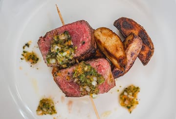 a plate of food on a white surface